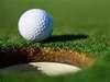 Close up of ball near hole